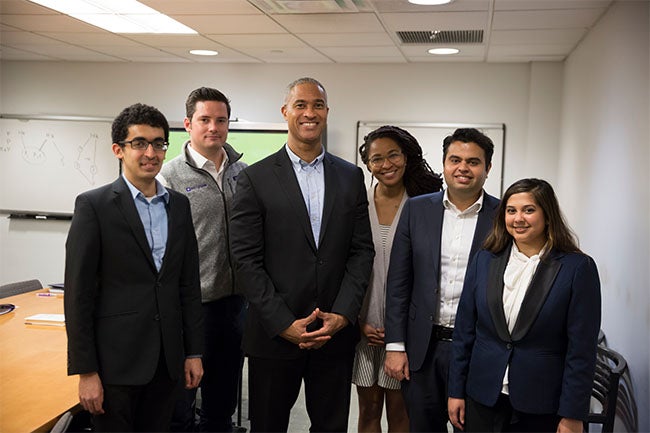 Dean Emeritus and Professor Peter Henry (Center) with (from left to right) Vikram Gulati (MBA '19), Sean Quinn (MBA '19), Nashilu Mouen-Makoua (MBA '18), Mohnish Zaveri (MBA '18) and Anila Mahadeo (MBA '18)