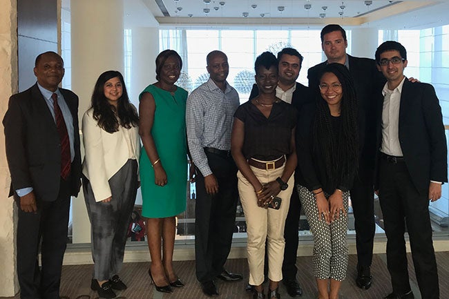 NYU Stern MBA students and alumni onsite in Guyana: Eric Phillips (MBA '83); Anila Mahadeo (MBA '18); Alisson Butters-Grant, CEO & President, Global Seafood Distributors, Inc; Selwin George (BS '93); Oslene Carrington (MBA '95); Mohnish Zaveri (MBA '18); Nashilu Mouen-Makoua (MBA '18); Sean Quinn (MBA '19); Vikram Gulati (MBA '19)