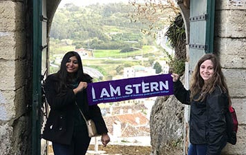 Jacqueline Finn and Tasnuva Tumim hold a "I am Stern" banner in Lisbon