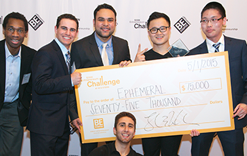 Josh Sakhai and teammates holding check for $75,000