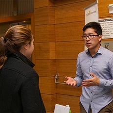 Student speaking with professional