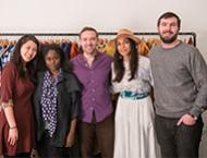 A group of NYU Stern MBA students stand with Stern alumna Abrima Erwiah (BS ‘02) and actress Rosario Dawson, co-founders of Studio One Eighty Nine