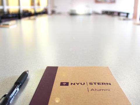 Alumni Council notebook on a conference table