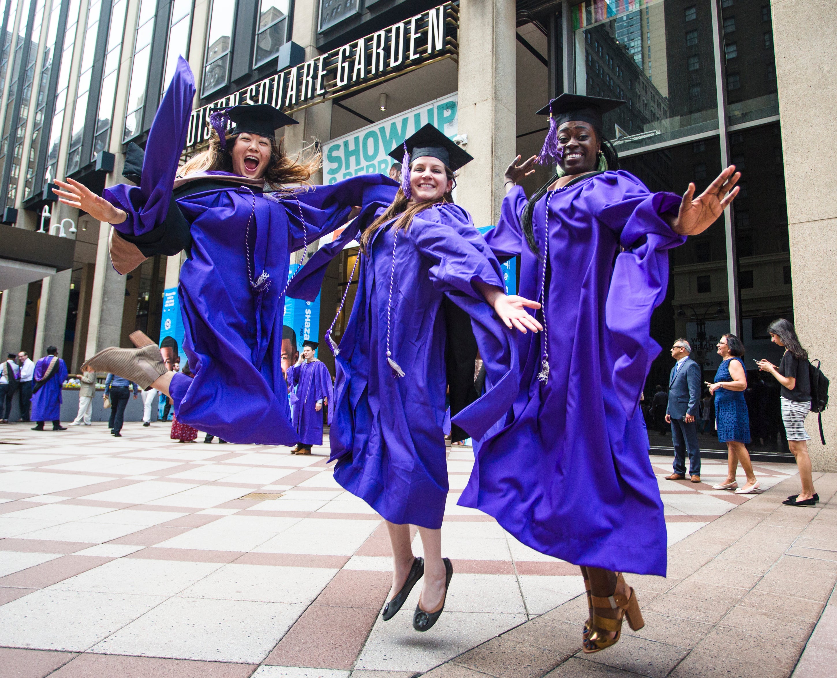 MBA graduates celebrate in front of Madison Square Garden