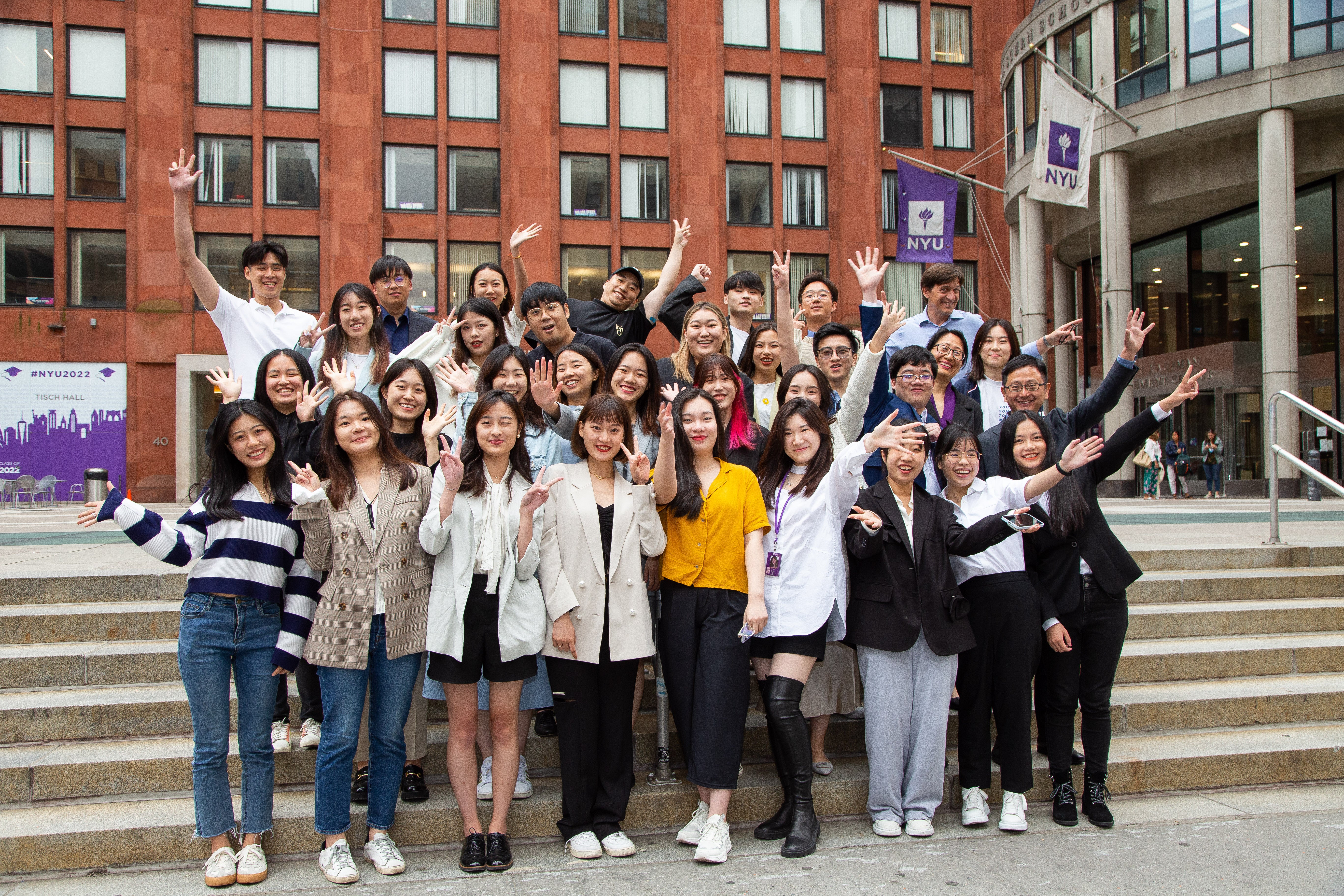 Students pose for a group photo after completing orientation