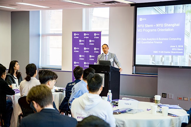 Assistant Dean of Graduate & Advanced Education at NYU Shanghai Eric Mao greets the inaugural one-year master’s programs cohorts