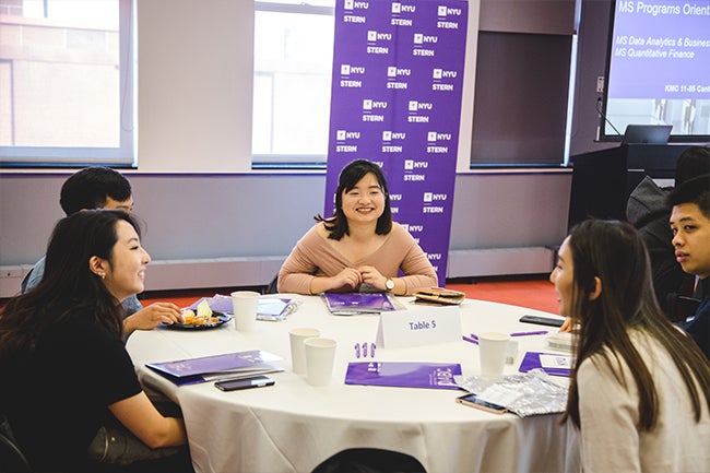 Students from the inaugural classes of the new one-year master’s programs engage in icebreakers