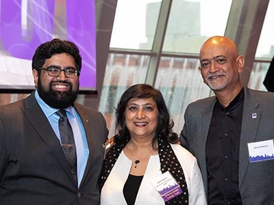 Dean Menon poses for a picture with her son and her brother