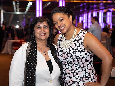 Dean Menon poses with alumna Devon McLeod