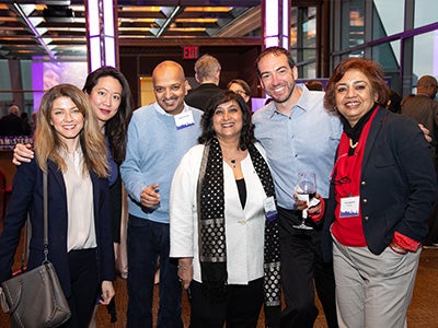 Dean Menon poses with colleagues