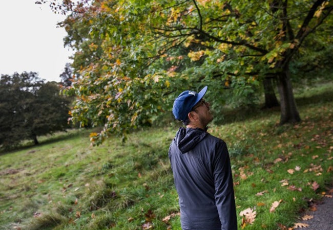 MBA business student Dennis Au strolls through a leafy area of London while studying abroad at London Business School. 