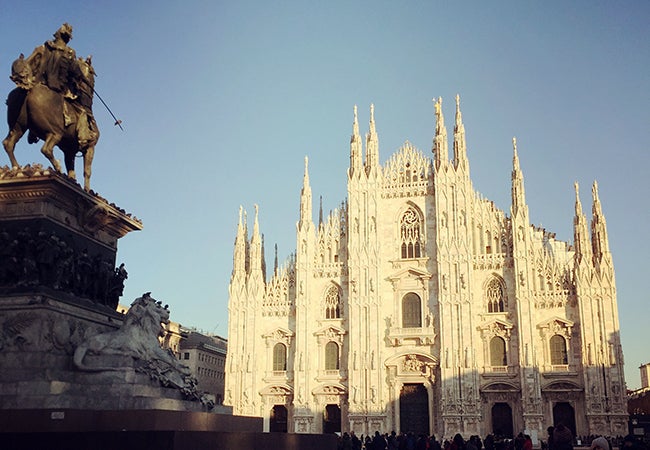 The magnificent white facade and turrets of Castello Sforzesco in Milan.