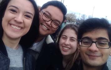 Nicole and three friends smile for a selfie