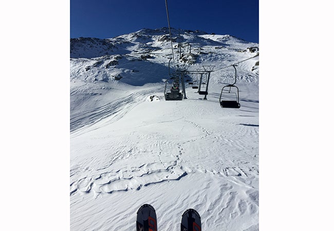 A chairlift transports passengers at a ski resort in the town of Madesimo, Italy. 