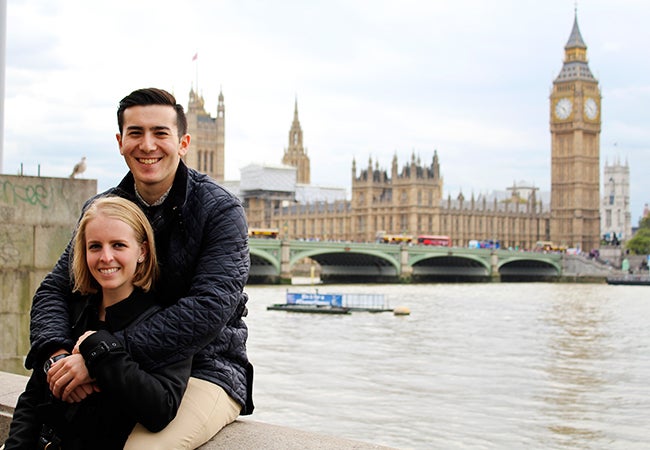 Undergraduate student Michelle Enkerlin leans into the arms of her boyfriend with the River Thames in the background. 