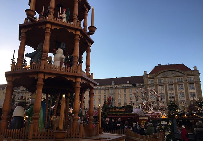 A carousel of snowmen and other seasonal characters stands at the center of the Dresden Christmas market.