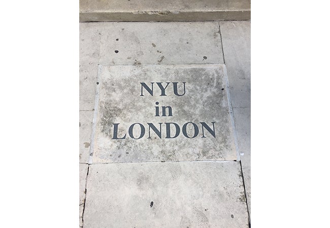 The phrase "NYU in London" is etched into stone.