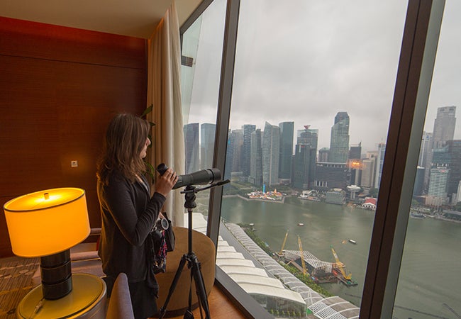 Student looking out a window in Singapore