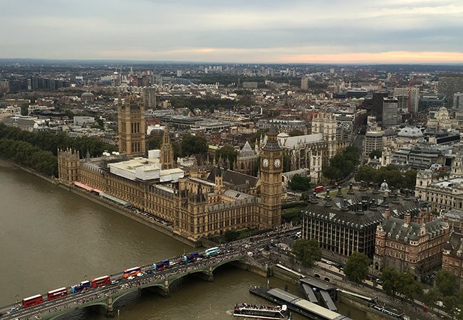 An aerial view of London shows Big Ben and the River Thames.  