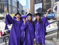 Three students celebrate outside of MSG before their May 10 graduation ceremony.