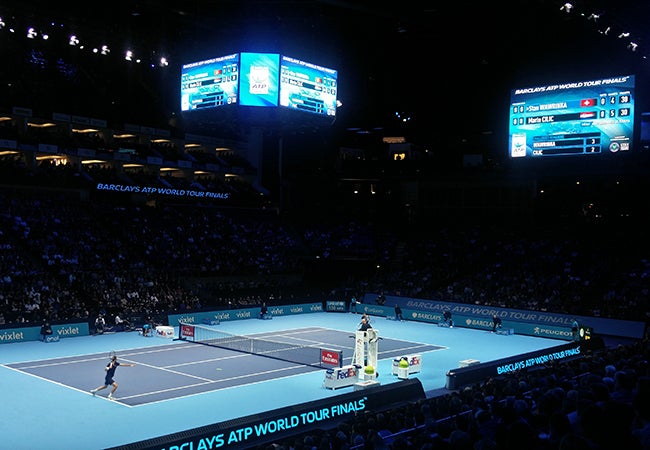 Tennis players Stan Wawrinka and Marin Cilic compete in an indoor stadium at the 2016 ATP World Tour Finals. 