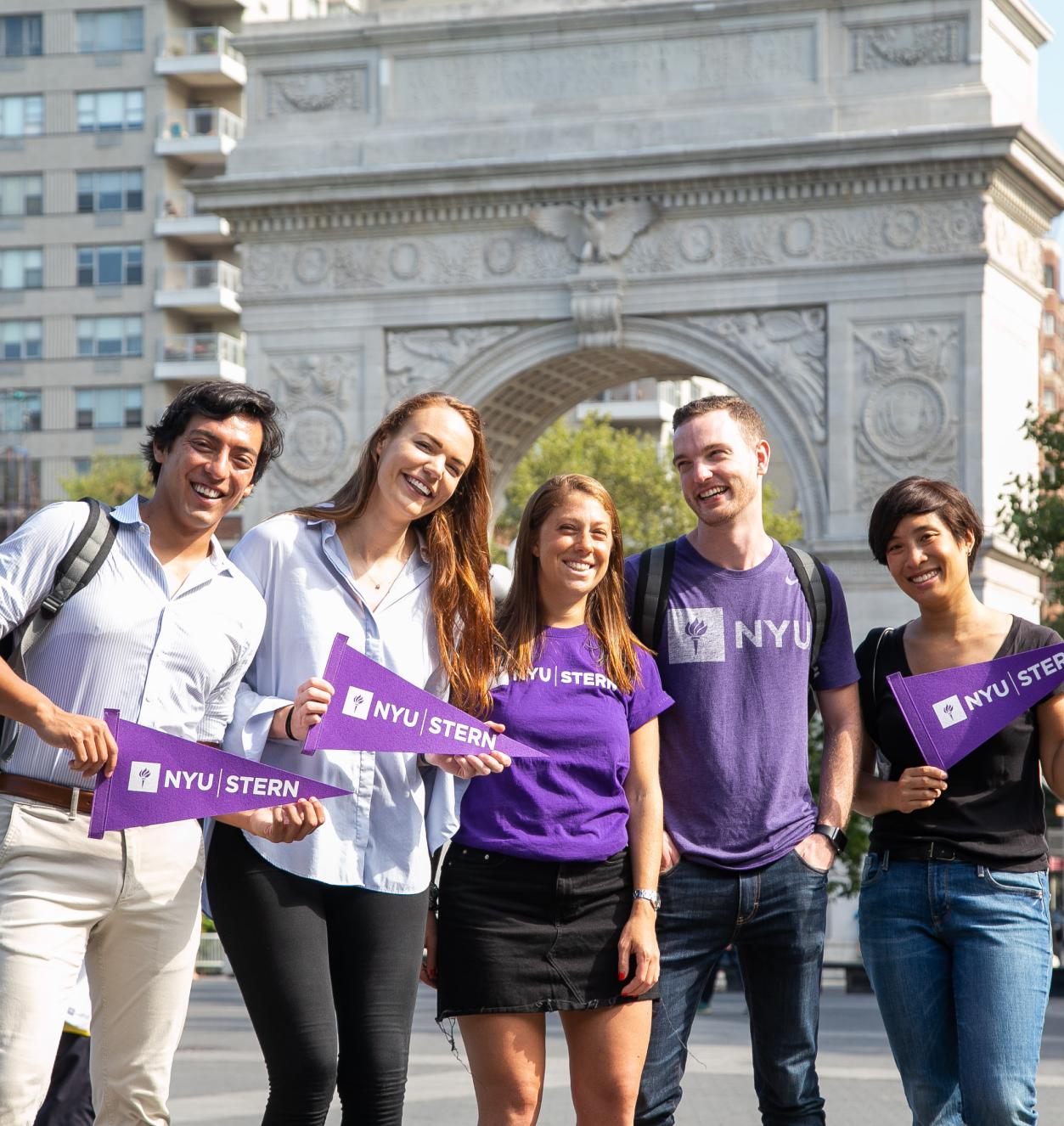 Stern students gather in front of the arch in Washington Square Park