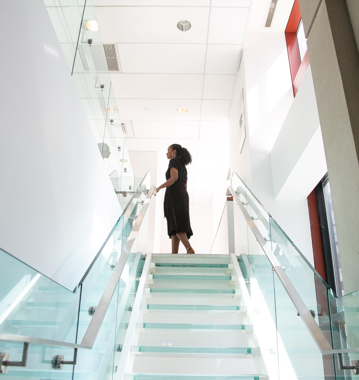 image of woman on top of staircase