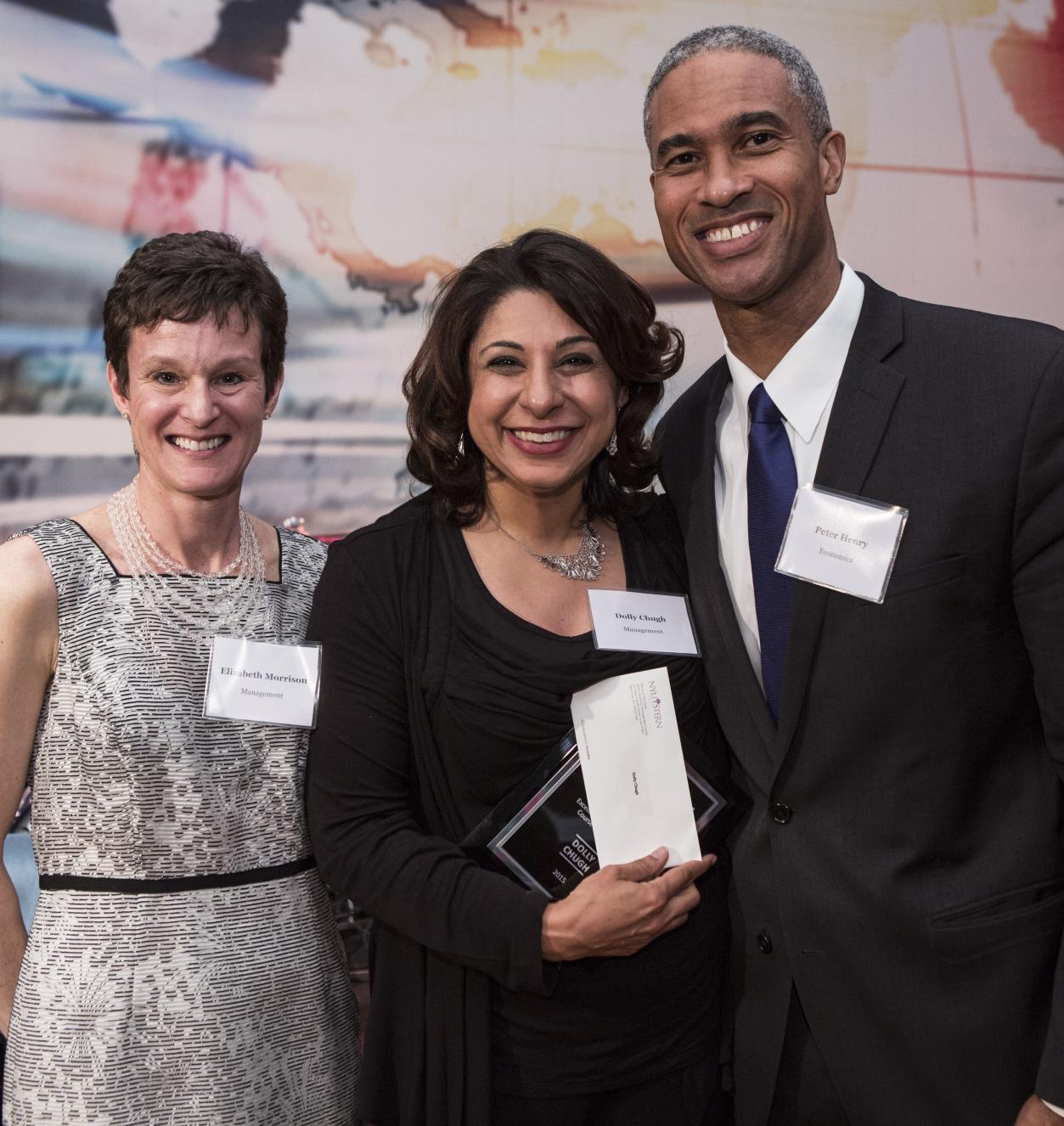 Elizabeth Morrison, Dolly Chugh, and Peter Henry at a faculty awards ceremony