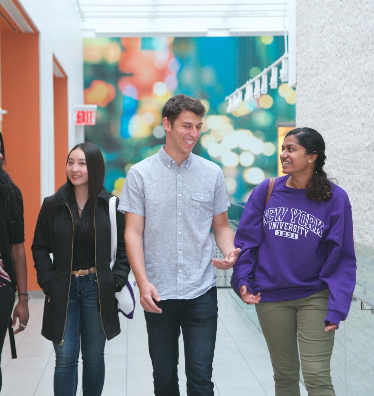 Students at Stern - Giving to Stern Students walking down the hall of Tisch