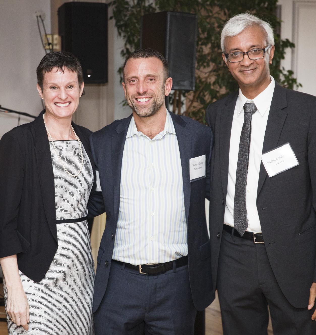 Elizabeth Morrison, Steve Blader, and Raghu Sundaram at faculty awards dinner