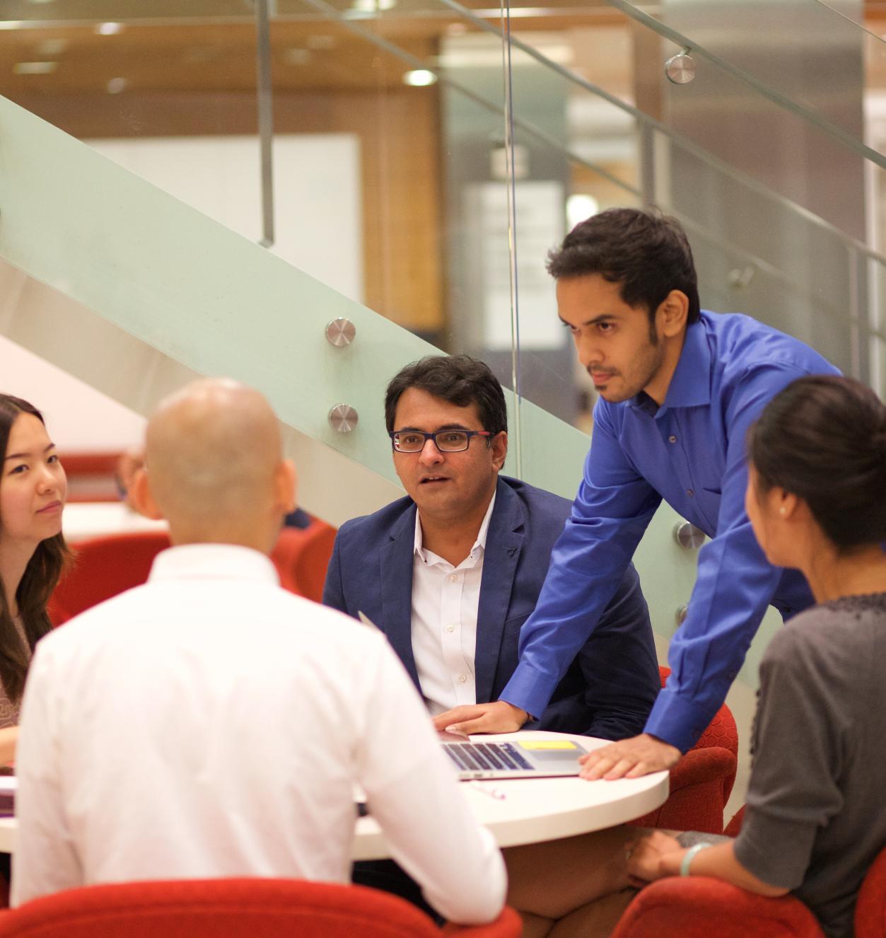 Students sitting around a table working