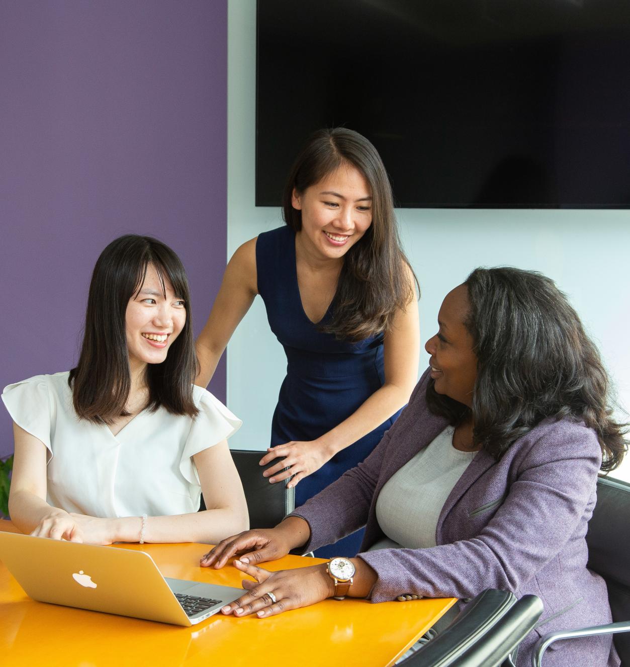 3 women in a conference room