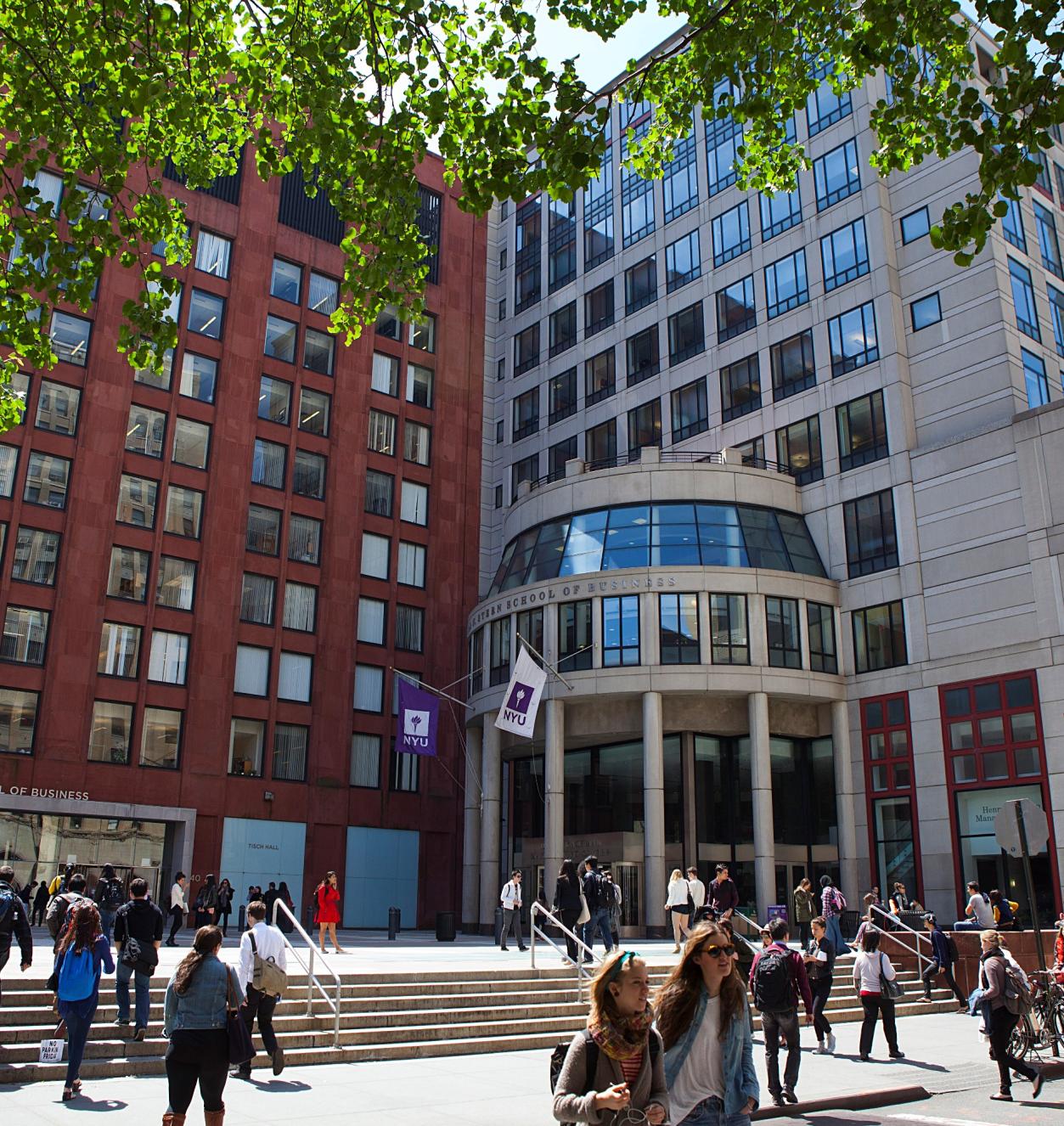 Exterior shot of Stern buildings with people walking on sidewalk