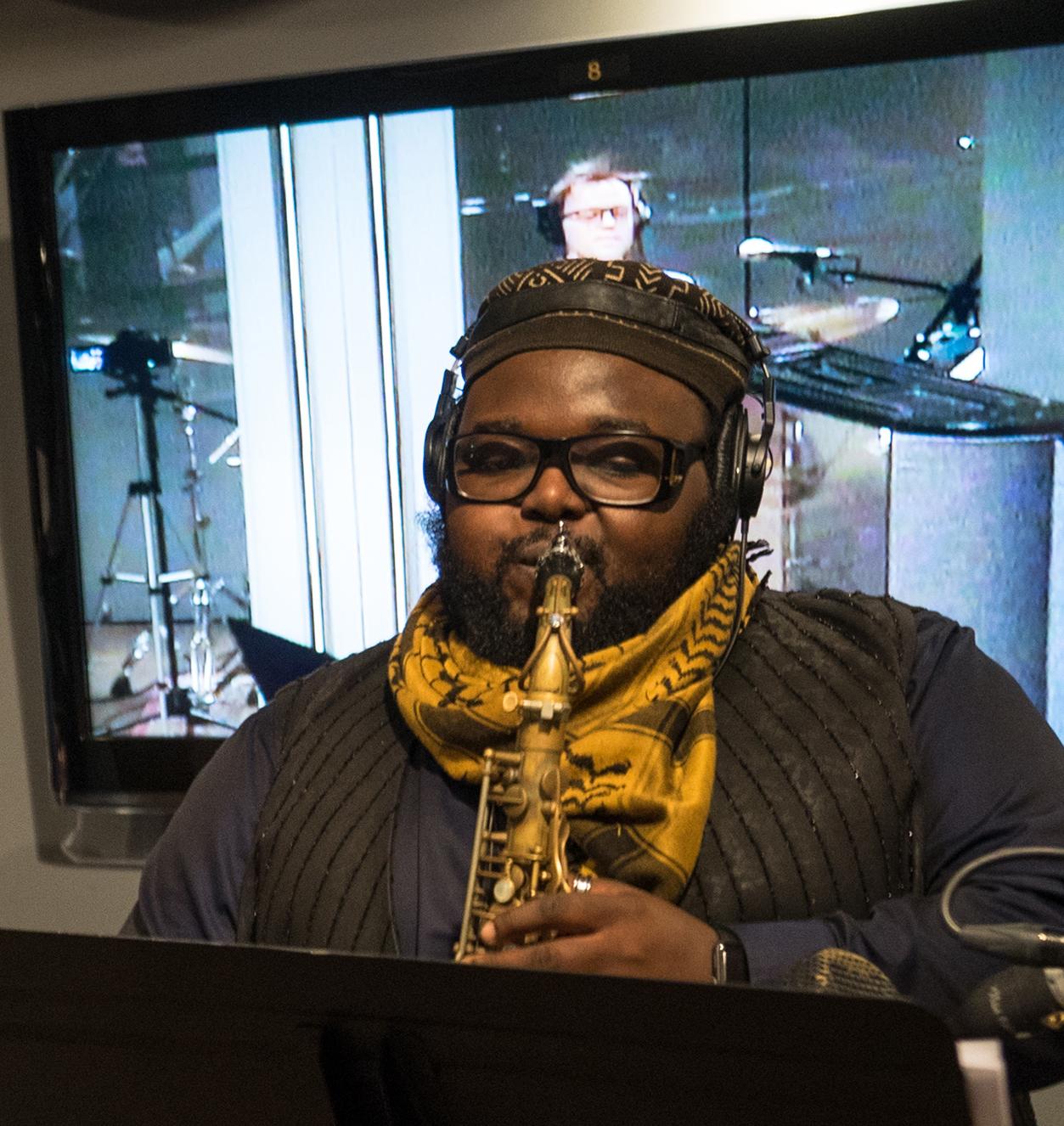 A student plays the saxophone at an NYU studio