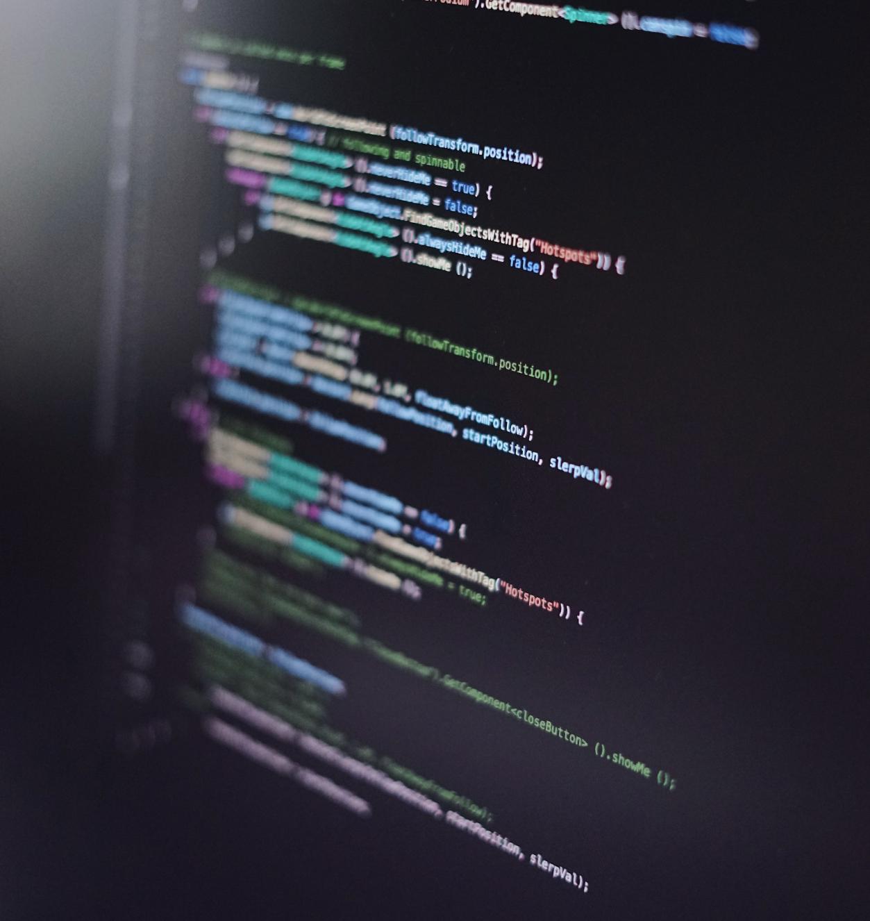 Colorful programming code on black screen. 