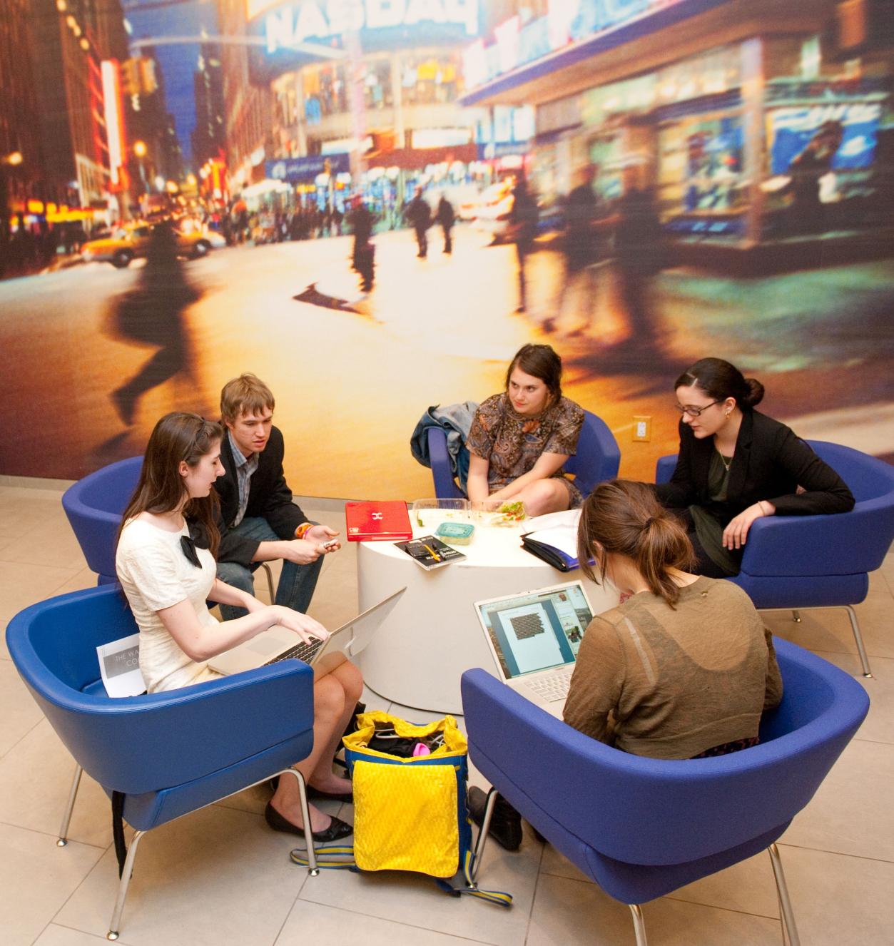 Students seated around a low table in the lounge