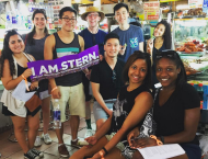 Students holding up banner 