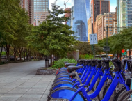 City sidewalk with bikeshare.