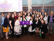 Dean Menon and Stern Undergraduate College Team pose with I am Stern sign