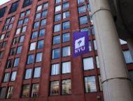 NYU Stern Tisch building with NYU flag