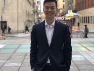 Daniel Fang in front of Tisch Hall