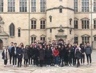 A group of students stands in front of Kronborg Castle