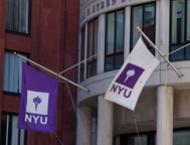 NYU flags outside of the Henry Kaufman Management Center