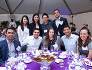 A group of Stern Alumni pose at a Reunion 2018 event