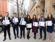 A group of NYU Stern EMBA students at a March 27 graduation.