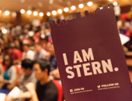 I am Stern logo in front of incoming class of students