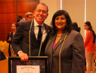 Joseph J. Sitt holding his honorary degree with Dean Menon