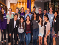 Group of returning Stern alumni posing during event