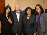 Dean Menon posing with Etka Kapoor and two students