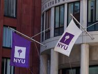 NYU flags outside of the Henry Kaufman Management Center